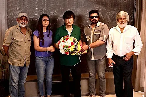 Actors Prashanth and Simran are seen alongside Karthik in the image.