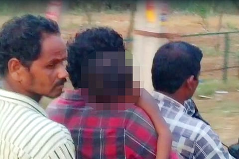 The child's body being carried by her family on their bike
