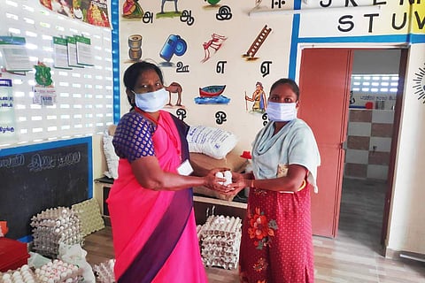 Anganwadi worker distributing eggs to a beneficiary in Virudhunagar amid Covid-19 lockdown.