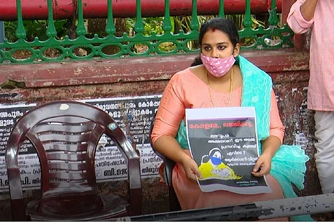 Kerala mother Anupama Chandran sitting in protest