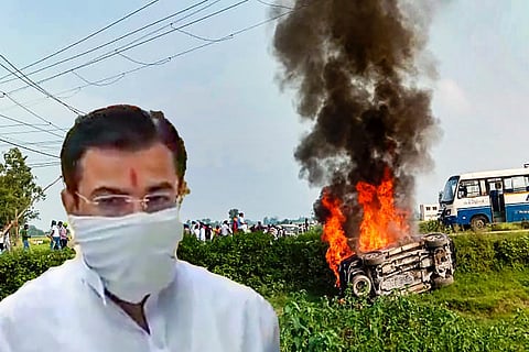 Ashish Mishra in mask and white kurta next to background of car burning