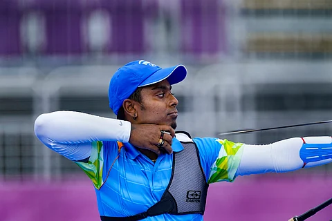 Atanu Das aims in an archery match at the Tokyo Olympics