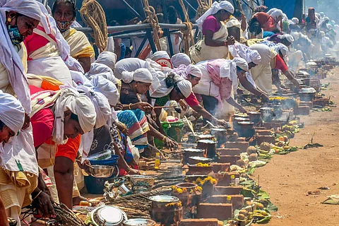 Women devotees take part in Attukal Pongala