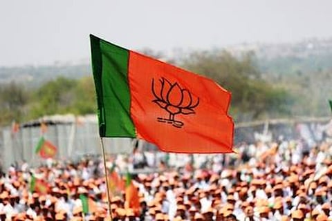 A BJP flag at a rally: Gujarat BJP’s post on Ahmedabad blasts verdict slammed, removed from Twitter and FB
