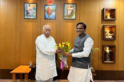 BJP Minister Raosaheb Danve handing a flower bouquet to RSS chief Mohan Bhagwat