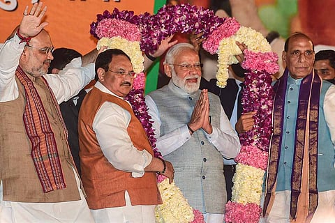 Prime Minister Narendra Modi greeted by senior BJP leaders at the party headquarters in Delhi