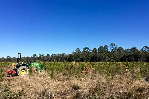 A representative image of a tractor on a barren land