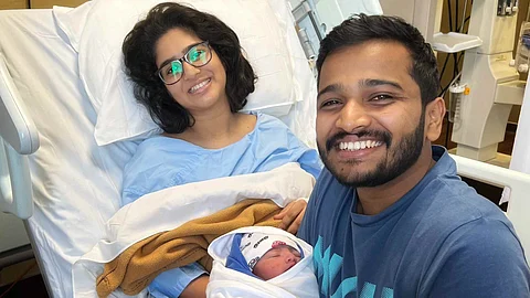 Basil Joseph along with his first child and wife Elizabeth