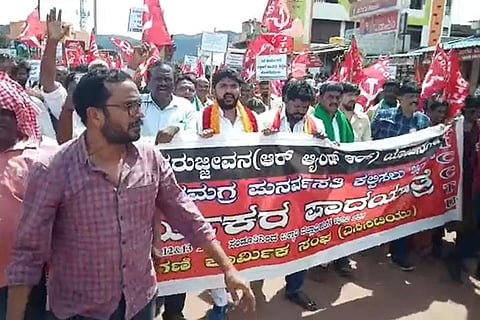 Mine workers who lost their jobs in 2011 hold a padayatra