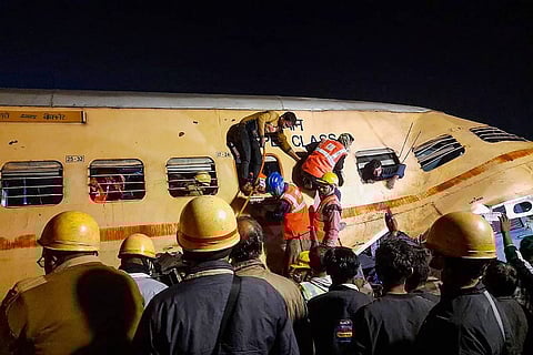 Workers at the site of the accident, carrying out rescue and relief works