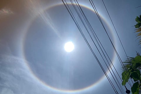 Photograph of the rainbow coloured halo seen around the sun above Bengaluru