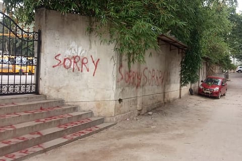 The word sorry seen spray painted all across the entrance of the school in Bengaluru