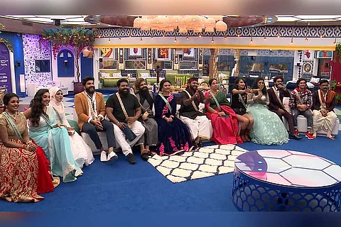 Bigg Boss Malayalam 3 candidates sit in a row listening to Mohanlal