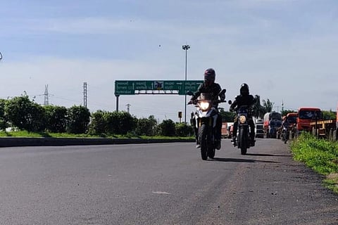 Two bikers on a highway