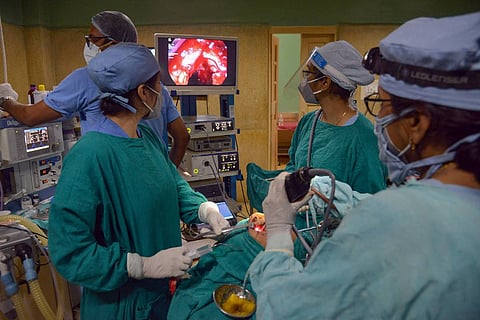 Doctors treat a Black Fungus infected patient in the operation theatre of a medical college and hospital in Jabalpur