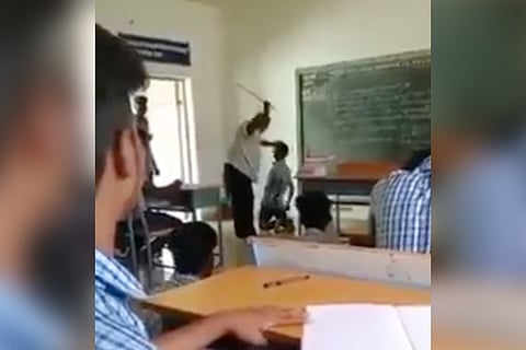 A student being trashed by a teacher