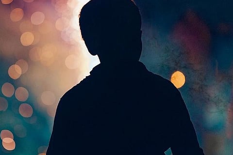 Representative image - Silhouette of a boy against a sparkling background