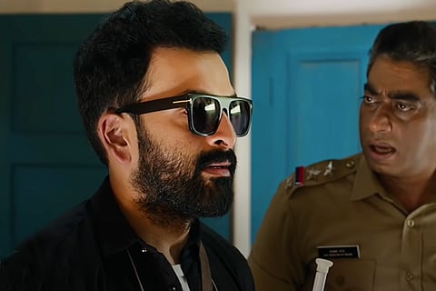Prithviraj in Bhramam film wearing sunglasses and a black shirt