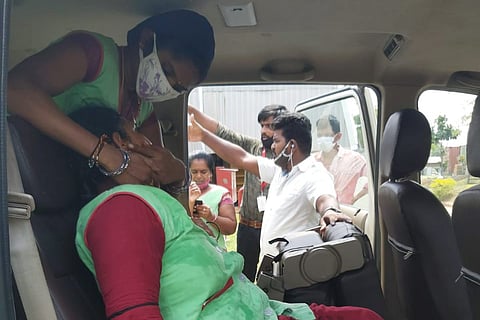 One of the women who fell ill after the ammonia gas leak at Andhra apparel SEZ being taken to a hospital