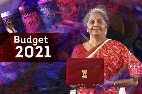 Special image showing budget 2021 text near Finance Minister Nirmala Sitharaman holding the budget tablet