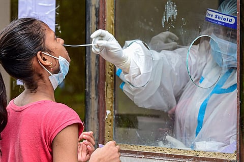 A woman getting her samples taken forCOVID test