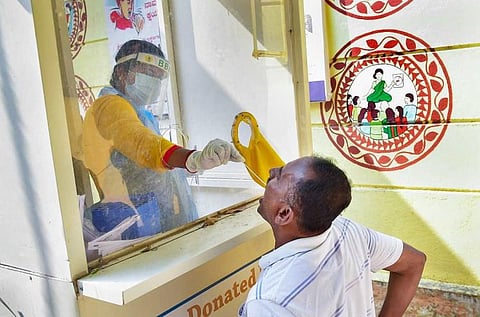 COVID 19 sample ebeing collected in Bengaluru by a BBMP staff