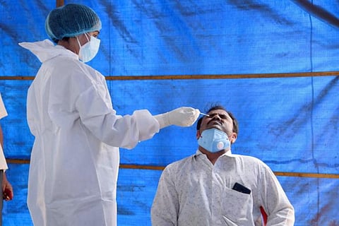 A healthcare worker collecting sample for COVID-19 test