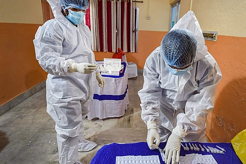 Doctors wearing PPE kits