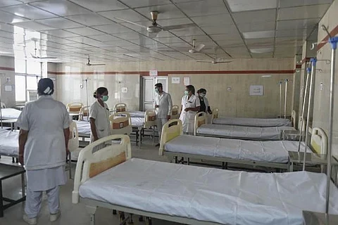 Nurses in white attire at a COVID-19 Hospital ward
