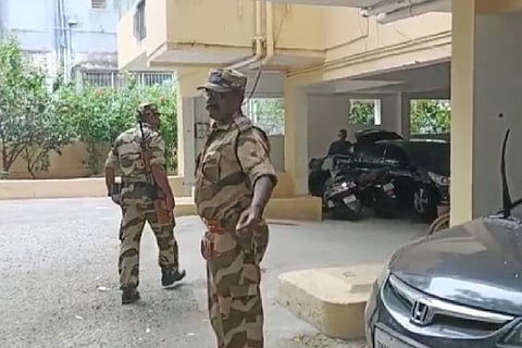 CRPF officers outside G Square during the raids