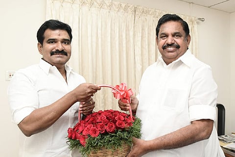 CTR Nirmal Kumar giving a flower bouquet to AIADMK interim general secretary Edappadi K Palaniswami