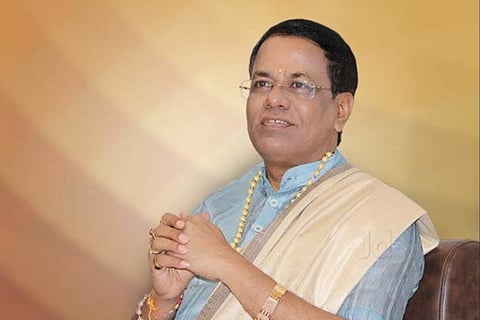 File image of Chandrashekhar Guruji in a blue shirt and a white shawl