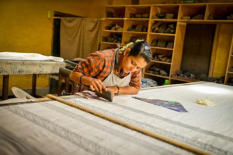A woman involved in weaving work at Charaka Society, Heggodu, Karnataka