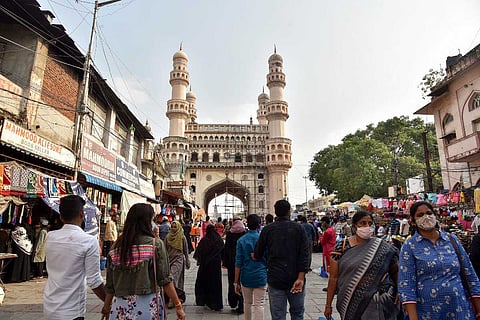 Visitors walk on a street leading to the historic Charminar closed in view of surge in coronavirus cases