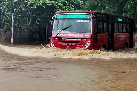 Chennai rains: A bus going through a waterlogged road in Chennai after heavy rainfall led to inundation in many areas