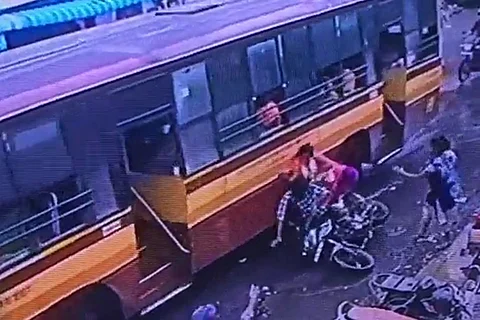 Video: Chennai couple fall off bike due to pothole, barely avoid coming under bus