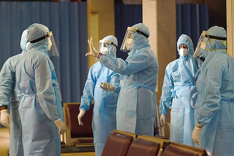 Several health personnel wearing PPE kits