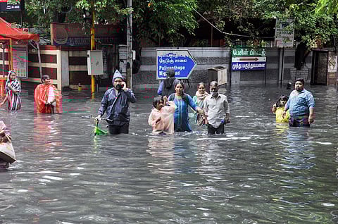 Chennai residents wade through waist-deep water in Pulianthope in November 2021
