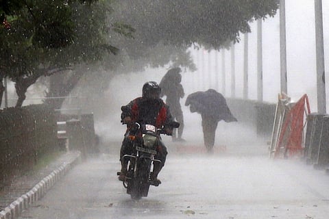 A biker riding in the rain