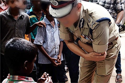Policewoman speaking to a child