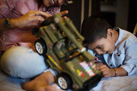 A child playing with a toy