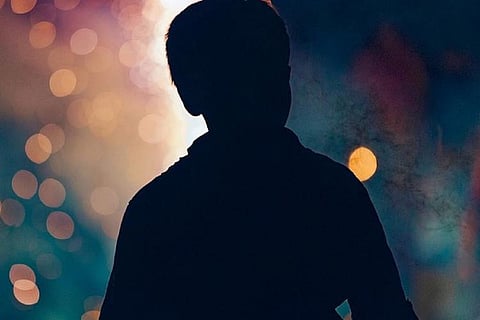 Image of a boy with fireworks background