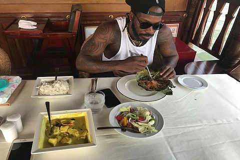 From eating Karimeen to doing Yoga, Chris Gayle enjoys holiday in Kerala