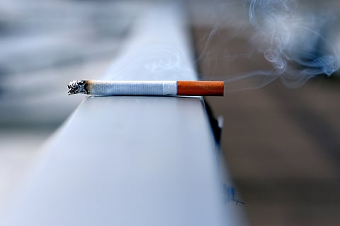Cigarette kept on a wall