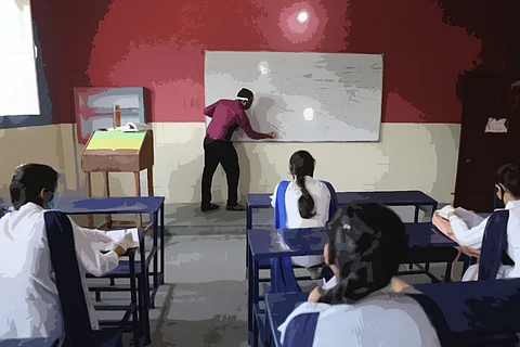 Classroom with male teacher and female students