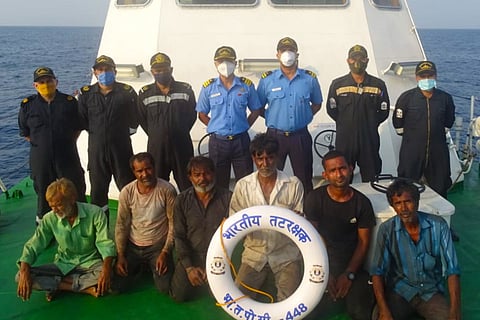 Coast guard with the rescued crewmen