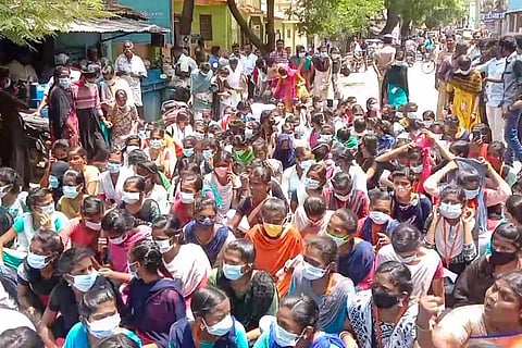 Students seated on the road in protest