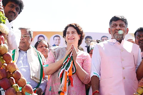 Priyanka Gandhi folded hands beside DK Shivakumar
