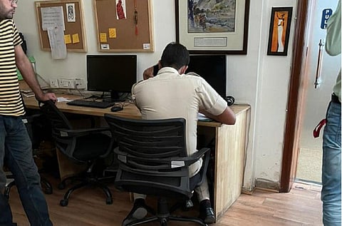 Cop at The Wire office in Delhi