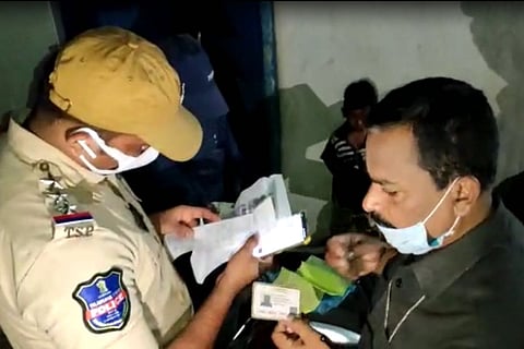 Police checking Aadhaar cards during the cordon and search operation